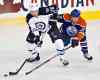 Jason Franson / The Canadian Press
Winnipeg Jets' Blake Wheeler (26) battles for the puck with Edmonton Oilers' Jeff Petry (2) during first-period NHL hockey action in Edmonton Tuesday.