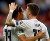 Germany's Marco Reus, right, and Leroy Sane celebrate during a Group C soccer qualifying match between Germany and Estonia in Mainz, Germany, Tuesday, June 11, 2019. (AP Photo/Michael Probst)