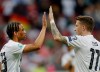 Germany's Marco Reus, right, and Leroy Sane celebrate during a Group C soccer qualifying match between Germany and Estonia in Mainz, Germany, Tuesday, June 11, 2019. (AP Photo/Michael Probst)