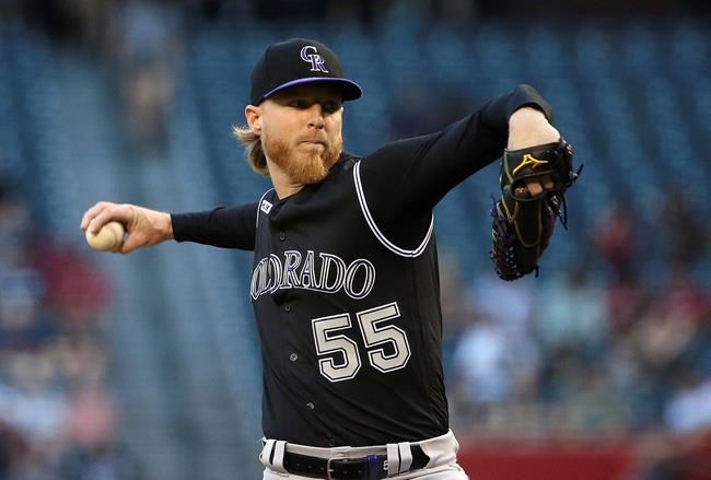 Colorado Rockies starting pitcher Jon Gray throws to an Arizona Diamondbacks batter during the first inning of a baseball game Wednesday, June 19, 2019, in Phoenix. (AP Photo/Ross D. Franklin)