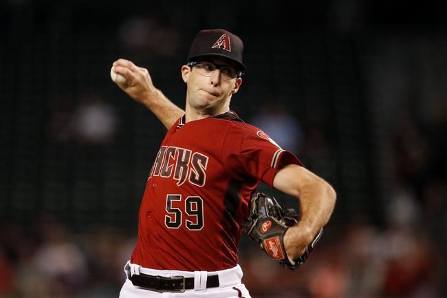 Arizona Diamondbacks starting pitcher Zac Gallen throws to a Philadelphia Phillies batter during the first inning of a baseball game Wednesday, Aug. 7, 2019, in Phoenix. (AP Photo/Ross D. Franklin)