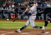 San Diego Padres' Eric Hosmer connects for a two-run single against the Arizona Diamondbacks during the first inning of a baseball game Saturday, April 13, 2019, in Phoenix. (AP Photo/Ross D. Franklin)