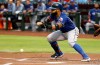 Texas Rangers' Rougned Odor lays down a bunt against the Arizona Diamondbacks during the first inning of a baseball game Tuesday, April 9, 2019, in Phoenix. Odor beat the throw to first base to get a single on the play. (AP Photo/Ross D. Franklin)