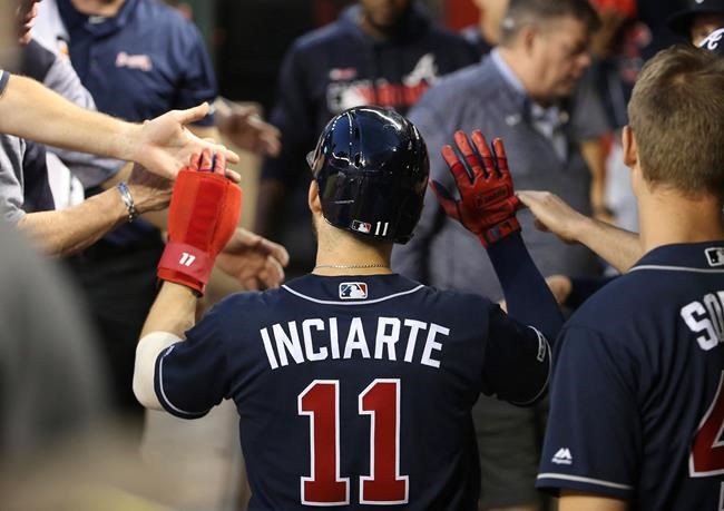 Atlanta Braves' Ender Inciarte (11) celebrates after scoring against the Arizona Diamondbacks during the third inning of a baseball game Thursday, May 9, 2019, in Phoenix. (AP Photo/Ross D. Franklin)