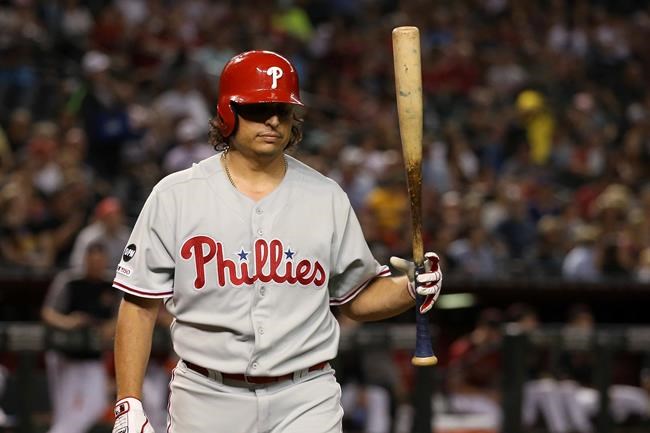 Philadelphia Phillies' Jason Vargas flips his bat after striking out against the Arizona Diamondbacks during the third inning of a baseball game Wednesday, Aug. 7, 2019, in Phoenix. (AP Photo/Ross D. Franklin)