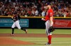 Washington Nationals starting pitcher Stephen Strasburg pauses with a new baseball after giving up a home run to Arizona Diamondbacks' Nick Ahmed, back left, during the second inning of a baseball game Saturday, Aug. 3, 2019, in Phoenix. (AP Photo/Ross D. Franklin)