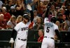 Arizona Diamondbacks' Eduardo Escobar (5) celebrates his home run against the Milwaukee Brewers with Christian Walker during the fourth inning of a baseball game Friday, July 19, 2019, in Phoenix. (AP Photo/Ross D. Franklin)