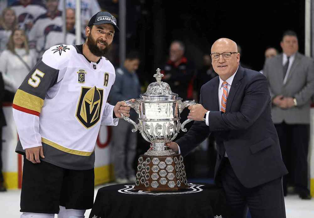 THE CANADIAN PRESS/Trevor Hagan
Vegas Golden Knights' Deryk Engelland, left, accepts the Clarence S. Campbell Bowl from Deputy Commissioner Bill Daly after defeating the Winnipeg Jets' during Western Conference Finals, game 5, in Winnipeg. The thoughts of what could have been will always be in the back of Jets coach Paul Maurice's mind.