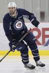 CP
Winnipeg Jets Zach Bogosian is all smiles as he takes part in an informal hockey practice in Winnipeg on Monday.