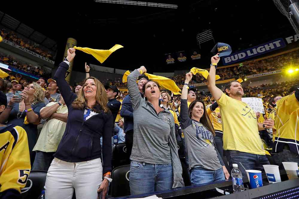 The Nashville Predators and Tampa Bay Lightning play in the first period of  an NHL Stadium Series hockey game in Nissan Stadium Saturday, Feb. 26, 2022,  in Nashville, Tenn. (AP Photo/Mark Humphrey