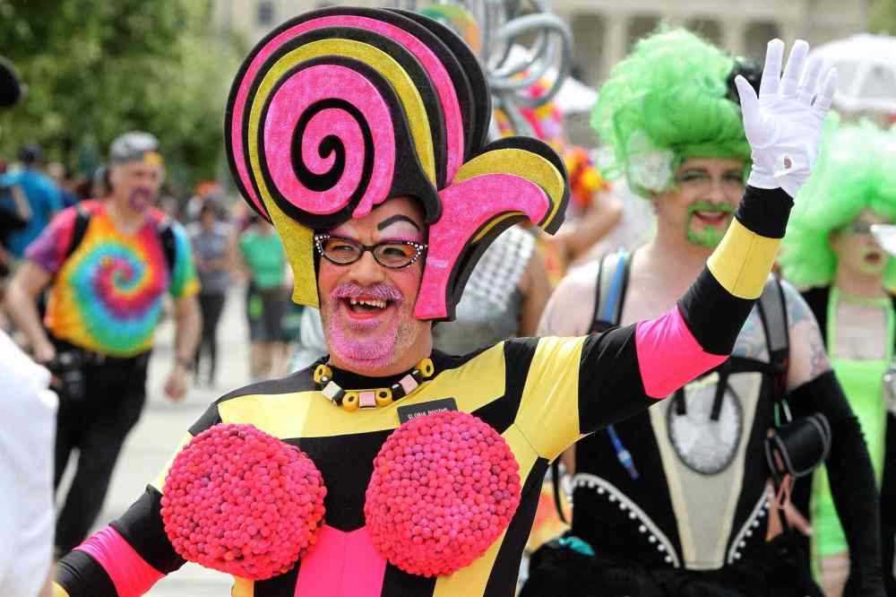 Mike Deal / Winnipeg Free Press
Participants in the 2014 Pride Parade take to downtown streets.