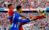 Munich's Jerome Boateng and Hertha's Davie Selke challenge for the ball during a German Bundesliga soccer match between Bayern Munich and Hertha BSC Berlin in Munich, Germany, Saturday, Feb.23,2019. (Matthias Balk/dpa via AP)