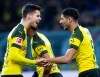 Dortmunds Achraf Hakimi, right, and Julian Weigl celebrate their side's opening goal during a German Bundesliga soccer match between Borussia Dortmund and Hannover 96 in Dortmund, Germany, Saturday, Jan. 26, 2019. (Guido Kirchner/dpa via AP)