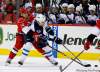 Gerry Broome / The Associated Press
The Carolina Hurricanes' Andreas Nodl and Winnipeg Jets' Bryan Little (18) chase the puck during the first period of their NHL  game in Raleigh, N.C., Monday.