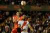 Real Madrid's Gareth Bale, left and Rayo Vallecano's Mario Suarez jumps for the ball during a Spanish La Liga soccer match between Rayo Vallecano and Real Madrid at the Vallecas stadium in Madrid, Spain, Sunday, April 28, 2019. (AP Photo/Paul White)