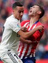 Real Madrid's Lucas Vazquez, left and Atletico Madrid's Lucas Hernandez collide during a Spanish La Liga soccer match between Atletico Madrid and Real Madrid at the Metropolitano stadium in Madrid, Spain, Saturday, Feb. 9, 2019. (AP Photo/Manu Fernandez)