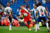Sevilla's Luuk de Jong, centre and Espanyol's Naldo challenges for the ball during the Spanish La Liga soccer match between Espanyol and Sevilla at the RCDE Stadium in Barcelona, Spain, Sunday Aug.18, 2019. (AP Photo/Joan Monfort)