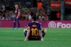 Barcelona's Lionel Messi sits on the ground after getting hurt during the Spanish La Liga soccer match between FC Barcelona and Villarreal CF at the Camp Nou stadium in Barcelona, Spain, Tuesday, Sep. 24, 2019. (AP Photo/Joan Monfort)