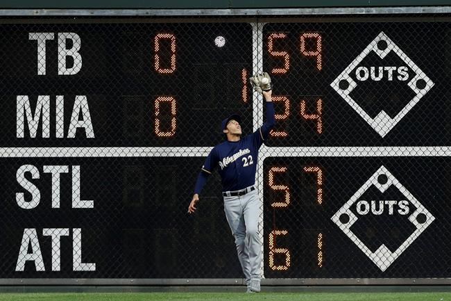 Milwaukee Brewers right fielder Christian Yelich catches a fly out by Philadelphia Phillies' Andrew McCutchen during the first inning of a baseball game, Tuesday, May 14, 2019, in Philadelphia. (AP Photo/Matt Slocum)