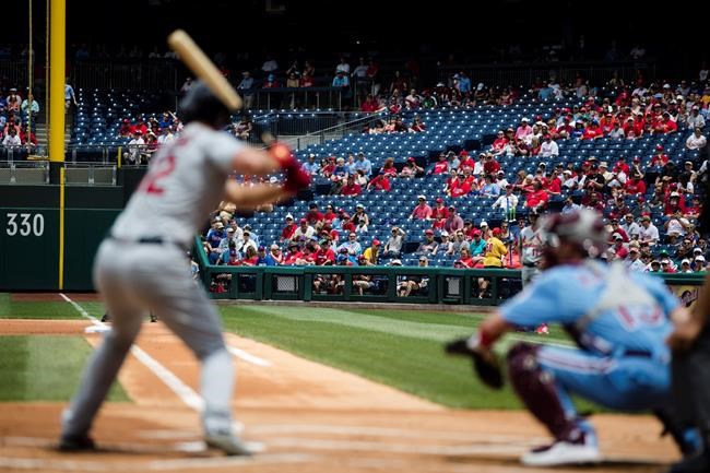 Fans view St. Louis Cardinals' Paul DeJong at bat and Philadelphia Phillies catcher Andrew Knapp during the first inning of a baseball game, Thursday, May 30, 2019, in Philadelphia. (AP Photo/Matt Rourke)