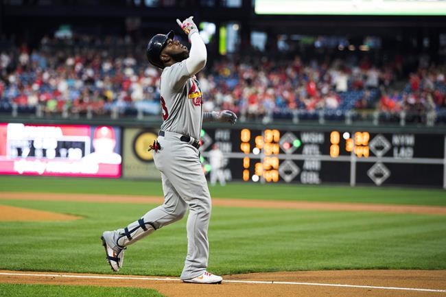 St. Louis Cardinals' Marcell Ozuna gestures after hitting a two-run home run off of Philadelphia Phillies starting pitcher Nick Pivetta during the first inning of a baseball game, Tuesday, May 28, 2019, in Philadelphia. (AP Photo/Matt Rourke)