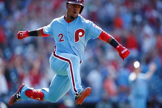 Philadelphia Phillies' Jean Segura celebrates after hitting a game-winning three-run home run off New York Mets relief pitcher Edwin Diaz during the ninth inning of a baseball game, Thursday, June 27, 2019, in Philadelphia. Philadelphia won 6-3. (AP Photo/Matt Slocum)