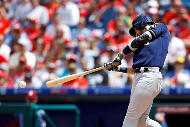 Milwaukee Brewers' Ryan Braun hits an RBI-single off Philadelphia Phillies starting pitcher Zach Eflin during the third inning of a baseball game, Thursday, May 16, 2019, in Philadelphia. (AP Photo/Matt Slocum)