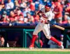 Philadelphia Phillies's Cesar Hernandez swings on a single during the sixth inning of a baseball game against the Boston Red Sox, Sunday, Sept. 15, 2019, in Philadelphia. (AP Photo/Laurence Kesterson)