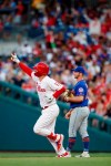 Philadelphia Phillies' Rhys Hoskins, left, reacts as he runs the bases past New York Mets first baseman Pete Alonso after hitting a home run off starting pitcher Walker Lockett during the fourth inning of a baseball game Tuesday, June 25, 2019, in Philadelphia. (AP Photo/Matt Slocum)