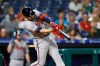 Atlanta Braves' Adam Duvall hits a two-run home run off Philadelphia Phillies starting pitcher Drew Smyly during the fourth inning of a baseball game Thursday, Sept. 12, 2019, in Philadelphia. (AP Photo/Matt Slocum)