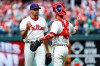 Philadelphia Phillies starting pitcher Zach Eflin, left, and catcher Andrew Knapp celebrate after a baseball game against the Miami Marlins, Sunday, April 28, 2019, in Philadelphia. Philadelphia won 5-1. (AP Photo/Matt Slocum)