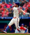 Philadelphia Phillies right fielder Bryce Harper (3) follows though on an RBI single during the sixth inning of a baseball game against the Washington Nationals, Sunday, May 5, 2019, in Philadelphia. Zach Eflin scored. The Phillies won 7-1. (AP Photo/Laurence Kesterson)