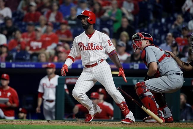 Philadelphia Phillies' Andrew McCutchen follows the flight of the ball after hitting a home run with one run batted in off of St. Louis Cardinals pitcher Michael Wacha during the fifth inning of a baseball game, Wednesday, May 29, 2019, in Philadelphia. (AP Photo/Matt Rourke)