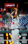Los Angeles Dodgers relief pitcher Kenley Jansen stretches during the ninth inning of the team's baseball game against the Philadelphia Phillies, Tuesday, July 16, 2019, in Philadelphia. Philadelphia won 9-8. (AP Photo/Matt Slocum)