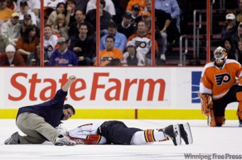 MATT SLOCUM / THE ASSOCIATED PRESS ARCHIVES 
Flyers goalie Ray Emery looks on as Panthers forward Dvaid Booth is attended to.
