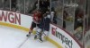 Comcast SportsNet
Chicago's Brandon Bollig crashes Adam Pardy into the glass, knocking the pane from its supports and onto the fans in the lowest rows at United Center.