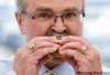 ADRIAN WYLD / THE CANADIAN PRESS
Agriculture Minister Gerry Ritz eats a pork sandwich during a barbecue put on by the Pork Council of Canada.