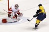 Mark Humphrey / Associated Press archives
Detroit Red Wings goalie Jimmy Howard blocks a shot by Nashville Predators right wing Matt Halischuk in the second period of an NHL hockey game, Sunday, April 14, in Nashville, Tenn.