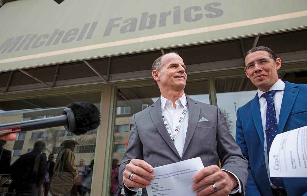 MIKE DEAL / WINNIPEG FREE PRESS FILES
Main Street Project Executive Director Rick Lees, left, and MP Robert-Falcon Ouellette at the announcement that Main Street Project had purchased the former Mitchell Fabrics building in May of 2018.