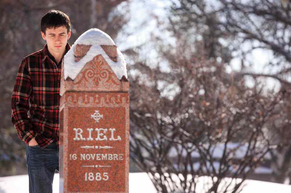 Melissa Tait / Winnipeg Free Pre
Ben Linnick quietly reflects at Louis Riel's marker at the St. Boniface Cathedral on Louis Riel day. Linnick said as a young Metis growing up in Flin Flon, Riel was a role model, and even more so now that he lives in Winnipeg.