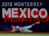 St. Louis Cardinals' Harrison Bader can't make the catch on a triple by Cincinnati Reds' Phillip Ervin during the eighth inning of a baseball game in Monterrey, Mexico, Saturday, April 13, 2019. The Reds defeated the Cardinals 5-2. (AP Photo/Rebecca Blackwell)