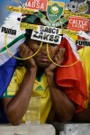 A South Africa fan reacts as his team is knocked out of the African Cup of Nations after losing to Mali on penalties in their quarterfinal soccer match, at Moses Mabhida Stadium in Durban, South Africa, Saturday, Feb. 2, 2013. (AP Photo/Rebecca Blackwell)