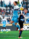 Lazio's Luiz Felipe, left, and Novara's Daniele Sciaudone vie for the ball during the Italian Cup soccer match between Lazio and Novara at the Olympic stadium in Rome, Saturday, Jan. 12, 2019. (Claudio Peri/ANSA via AP)