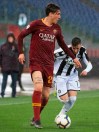 Roma's Nicolo Zaniolo, left, is challenged by Udinese's Marco D'Alessandro during the Serie a soccer match between Roma and Udinese at the Olympic Stadium in Rome, Saturday, April 13, 2019. (Claudio Peri/ANSA via AP)