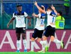 Atalanta's Duvan Zapata, left, celebrates with his teammates after he scored his side's first goal during a Serie A soccer match between Roma and Atalanta, at Rome's Olympic stadium, in Rome, Wednesday, Sept. 25, 2019. (Ettore Ferrari/ANSA via AP)