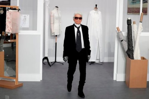 FILE - In this Tuesday, July 5, 2016 file photo, Karl Lagerfeld arrives at the end of Chanel's Haute Couture Fall-Winter 2016-2017 fashion collection presented in Paris. Chanel‚Äôs iconic couturier, Karl Lagerfeld, whose accomplished designs as well as trademark white ponytail, high starched collars and dark enigmatic glasses dominated high fashion for the last 50 years, has died. He was around 85 years old. (AP Photo/Francois Mori, File )