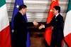 Chinese President Xi Jinping, left, and Italian Premier Giuseppe Conte shake their hands at the end of the signing ceremony of a memorandum of understanding at Rome's Villa Madama, Saturday, March 23, 2019. Jinping is in Italy to sign a memorandum of understanding to make Italy the first Group of Seven leading democracies to join China's ambitious Belt and Road infrastructure project. (AP Photo/Andrew Medichini)