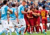 Roma's Aleksandar Kolarov, 4th from right, celebrates with his teammates after scoring on a penalty kick his side's opening goal during the Serie A soccer match between Lazio and Roma, at the Rome Olympic Stadium, Sunday, Sept. 1, 2019. (Claudio Peri/ANSA via AP)