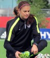 U.S. women’s soccer team forward Alex Morgan stretches during practice in Winnipeg, Manitoba, on Wednesday, June 3, 2015. Morgan returned to practice following a left knee injury as the United States prepares for the Women’s World Cup. (AP Photo/Anne M. Peterson)