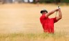 FILE - In this July 22, 2018, file photo, Tiger Woods of the U.S. plays out of a bunker on the 10th hole during the final round for the 147th British Open Golf championships in Carnoustie, Scotland. Woods considers this his most memorable shot of the year. (AP Photo/Peter Morrison, File)